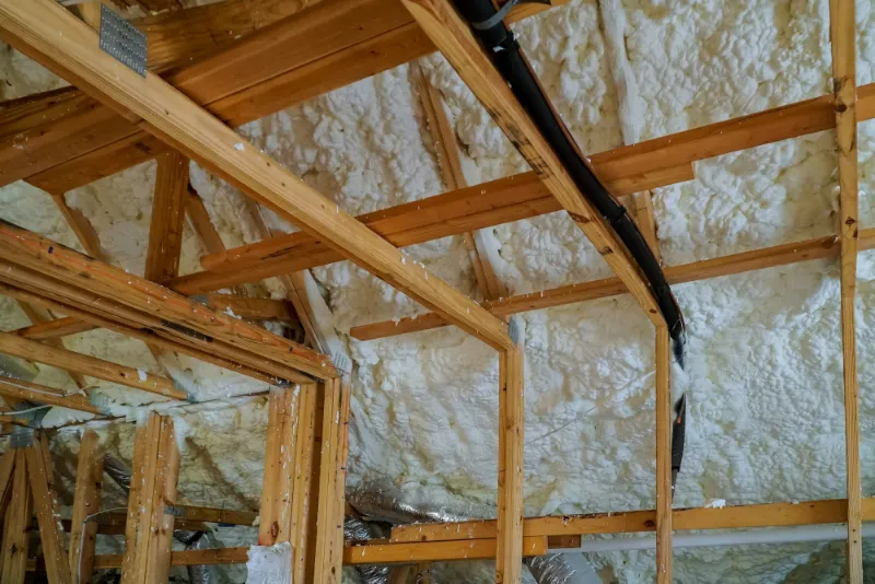 Spray foam insulation sprayed between loft rafters